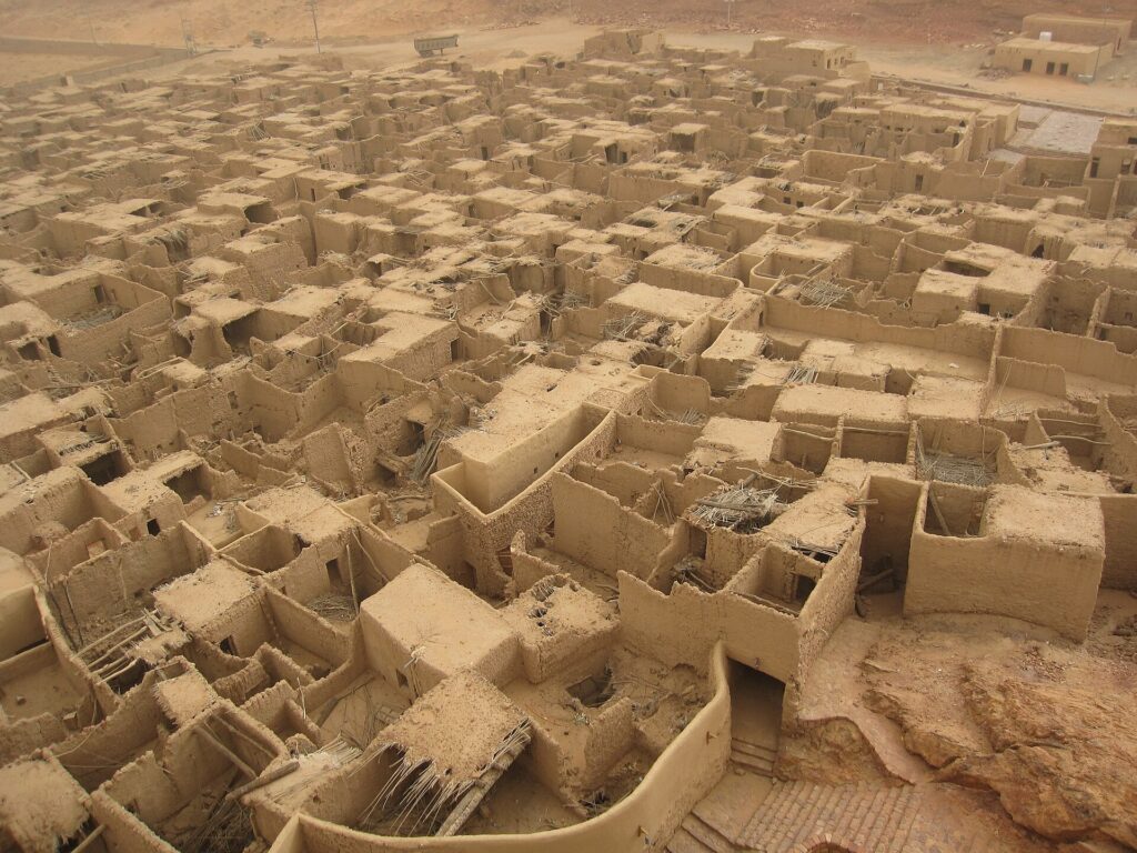 Restored mud-brick houses of AlUla Old Town at golden hour