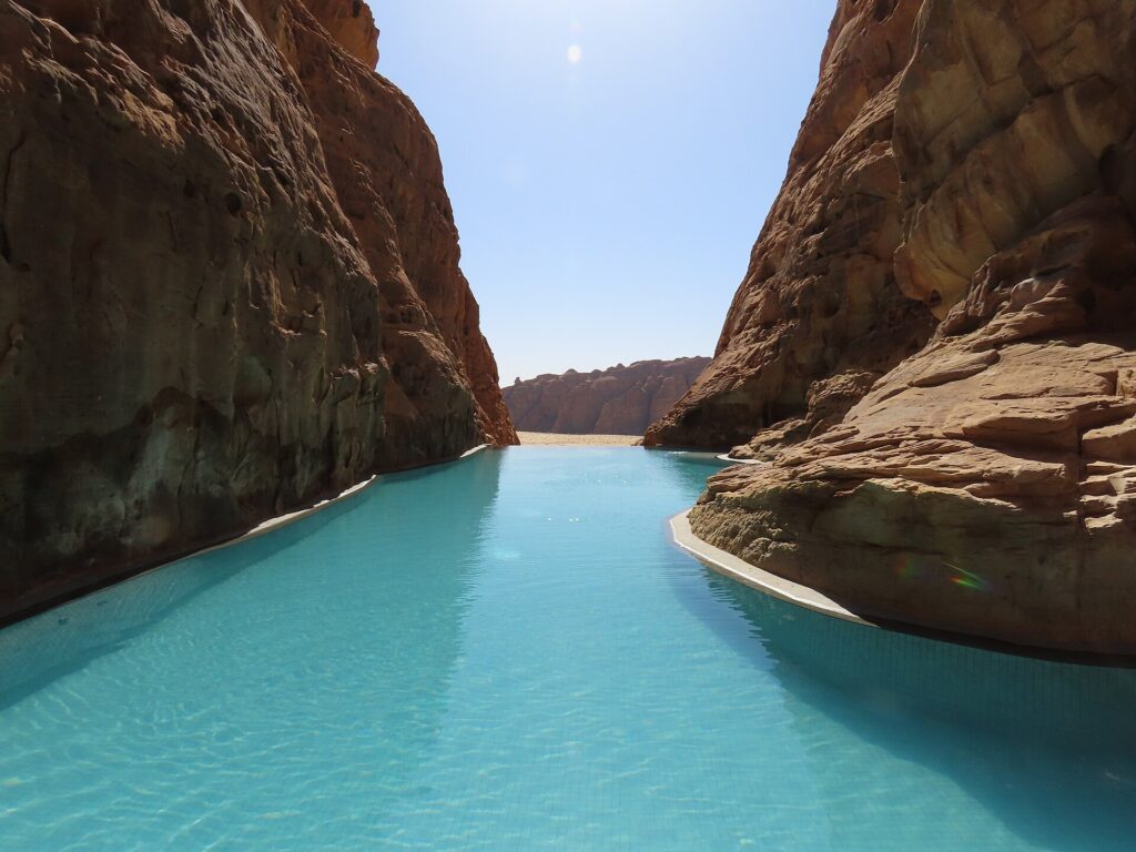 AlUla luxury resorts private-pool villa set beneath sandstone cliffs in Ashar Valley