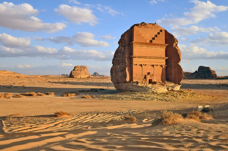 Qasr al-Farid, the largest and most famous of the Hegra tombs, standing alone on the desert plain