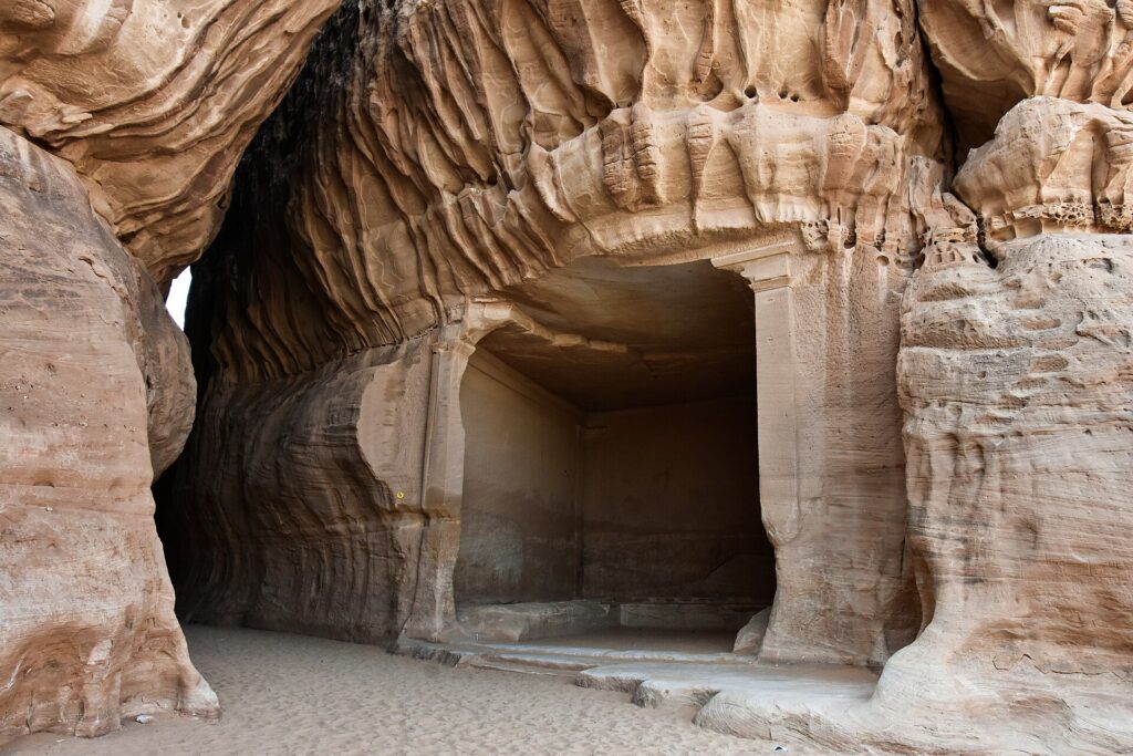 The rock-cut Diwan triclinium and Siq passage at Jabal Ithlib in Hegra