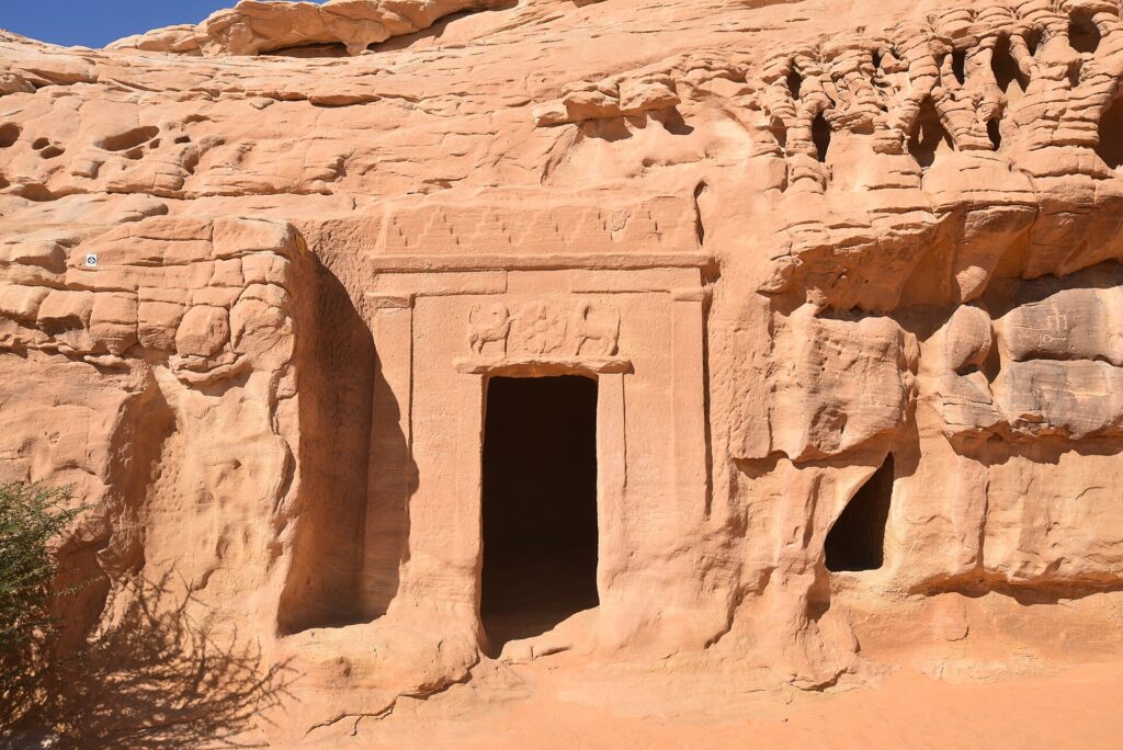 Carved Nabataean tomb facade in the sandstone at Hegra