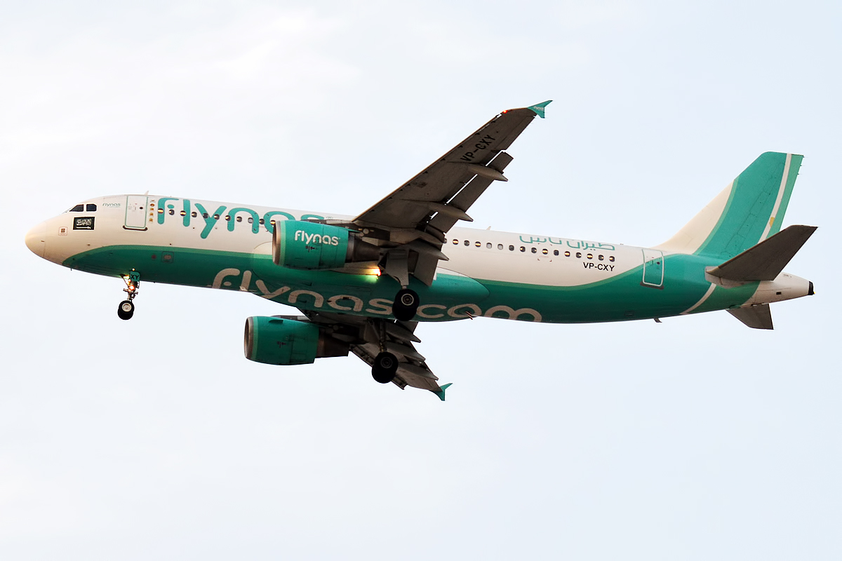 A flynas Airbus A320, a common way to travel Riyadh to AlUla, parked on the tarmac