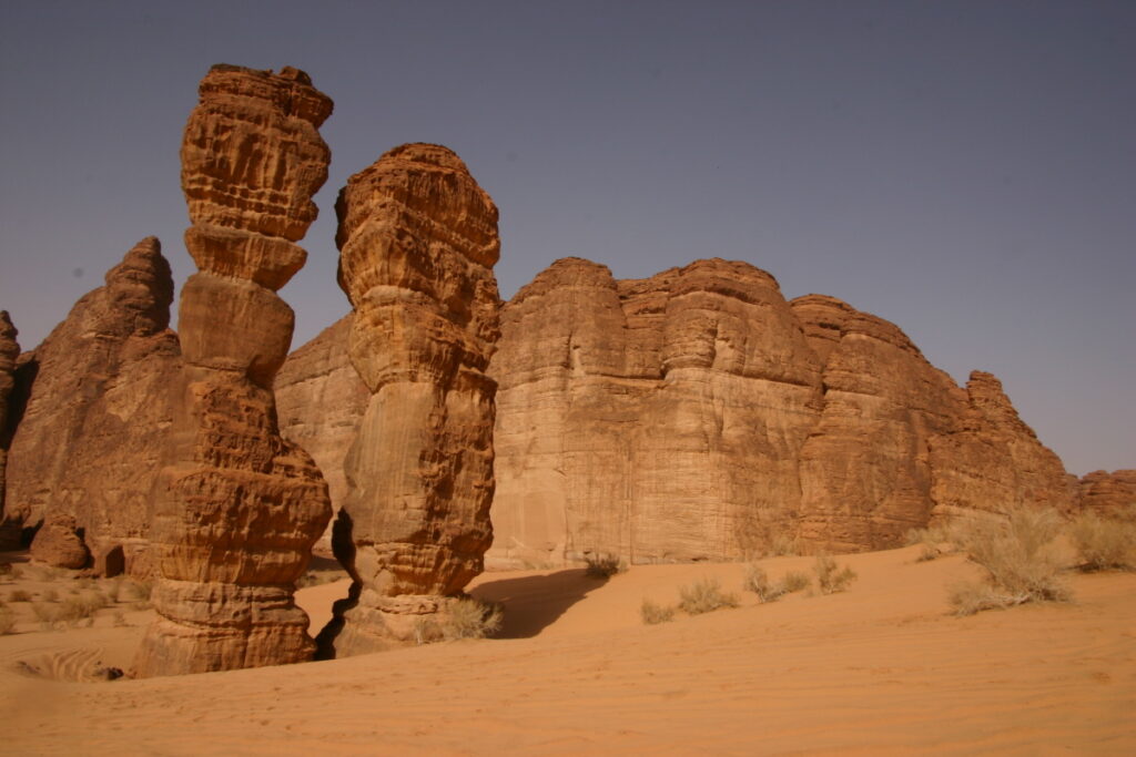 AlUla weather over desert sandstone cliffs and clear blue sky